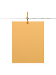 Image showing Orange paper sheet on a clothes line (+2 clipping paths)
