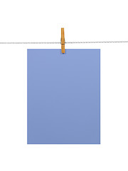 Image showing Purple-blue paper sheet on a clothes line (+2 clipping paths)