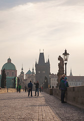 Image showing Charles bridge early in the morning with tourists