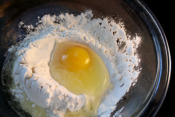 Image showing raw egg in flour