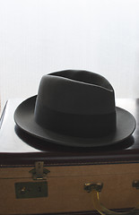 Image showing man's hat on a suitcase