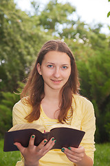 Image showing Teen girl reading book