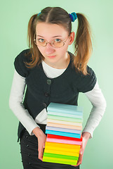 Image showing Teen girl with a stack of books