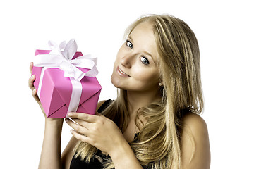 Image showing Pretty blond young girl with a present