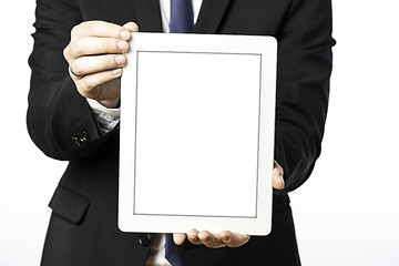 Image showing Business man shows his blank tablet computer