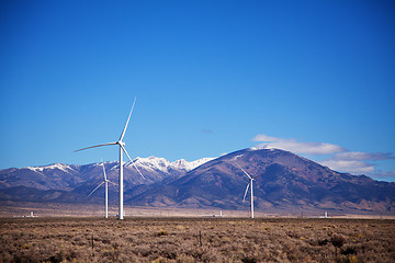 Image showing Power mills field in front of the mountain range