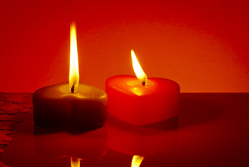 Image showing Two burning heart shaped candles