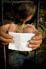 Image showing Man with hands tied up with rope