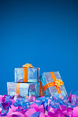 Image showing Christmas presents against blue background