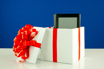 Image showing Electronic book reader in a box against blue background