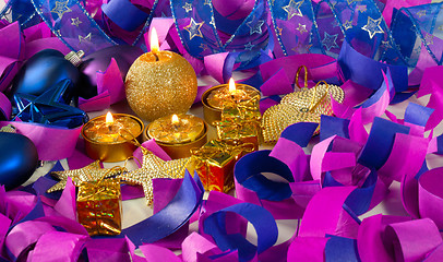 Image showing Christmas decorations and candles over blue background
