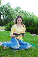 Image showing Teen girl reading book