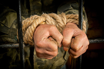 Image showing Man with hands tied up with rope