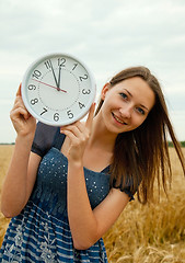 Image showing Teen girl holds watches