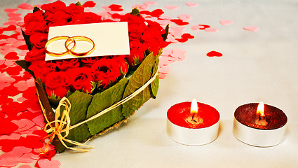 Image showing Two rings and a blank card with two candles