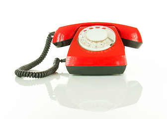 Image showing Red old fashioned telephone against white background