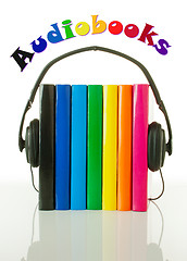 Image showing Row of books and headphones - Audiobooks concept