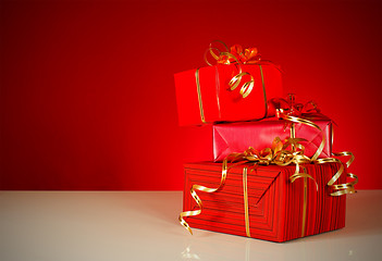Image showing Christmas gifts over red background