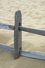 Image showing Old wooden fence on a beach