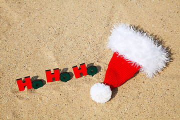 Image showing Wooden word 'Ho! Ho! Ho!' with Santa's hat