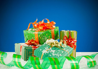 Image showing Christmas presents against blue background