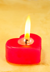 Image showing Burning heart shaped candle