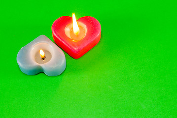 Image showing Two burning heart shaped candles