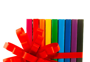 Image showing Row of colorful books tied up with ribbon