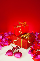 Image showing Valentine's day presents and hearts over red background