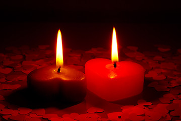Image showing Two burning heart shaped candle
