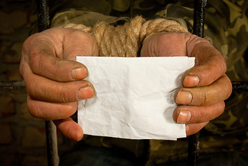 Image showing Man with hands tied up with rope