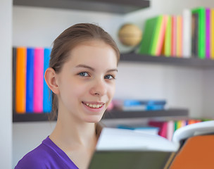 Image showing Teenage girl with a book