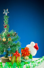 Image showing Christmas presents against blue background