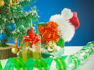 Image showing Christmas presents against blue background