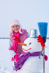 Image showing Teenage girl with snowman