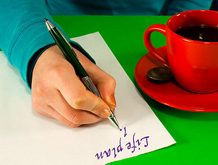 Image showing Female's hand writing a life plan