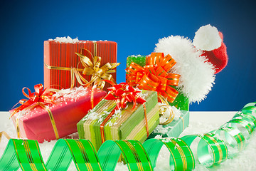 Image showing Christmas presents against blue background