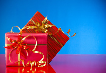 Image showing Christmas presents against blue background