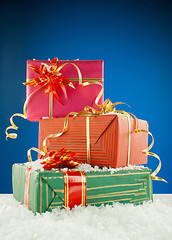 Image showing Christmas presents against blue background