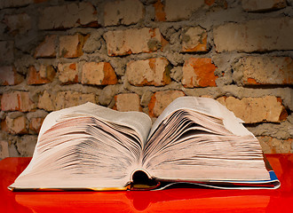 Image showing Open book laying on the table