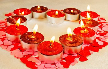 Image showing Many burning candles in a form of heart  
