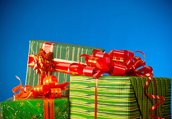 Image showing Christmas presents against blue background