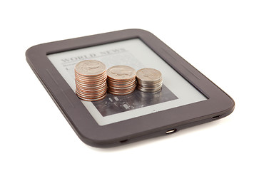 Image showing Electronic book reader with bars of coins