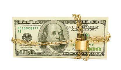 Image showing Stack of US 100 dollar bills chained and locked