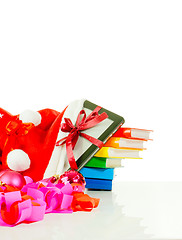 Image showing Electronic book reader with stack of books in bag against white background