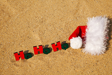 Image showing Wooden word 'Ho! Ho! Ho!' with Santa's hat
