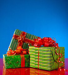 Image showing Christmas presents against blue background