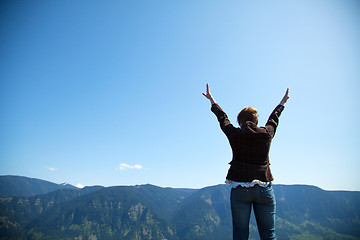 Image showing Woman with raised hands