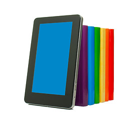 Image showing Row of colorful books and tablet PC