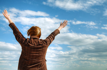 Image showing Woman with raised hands